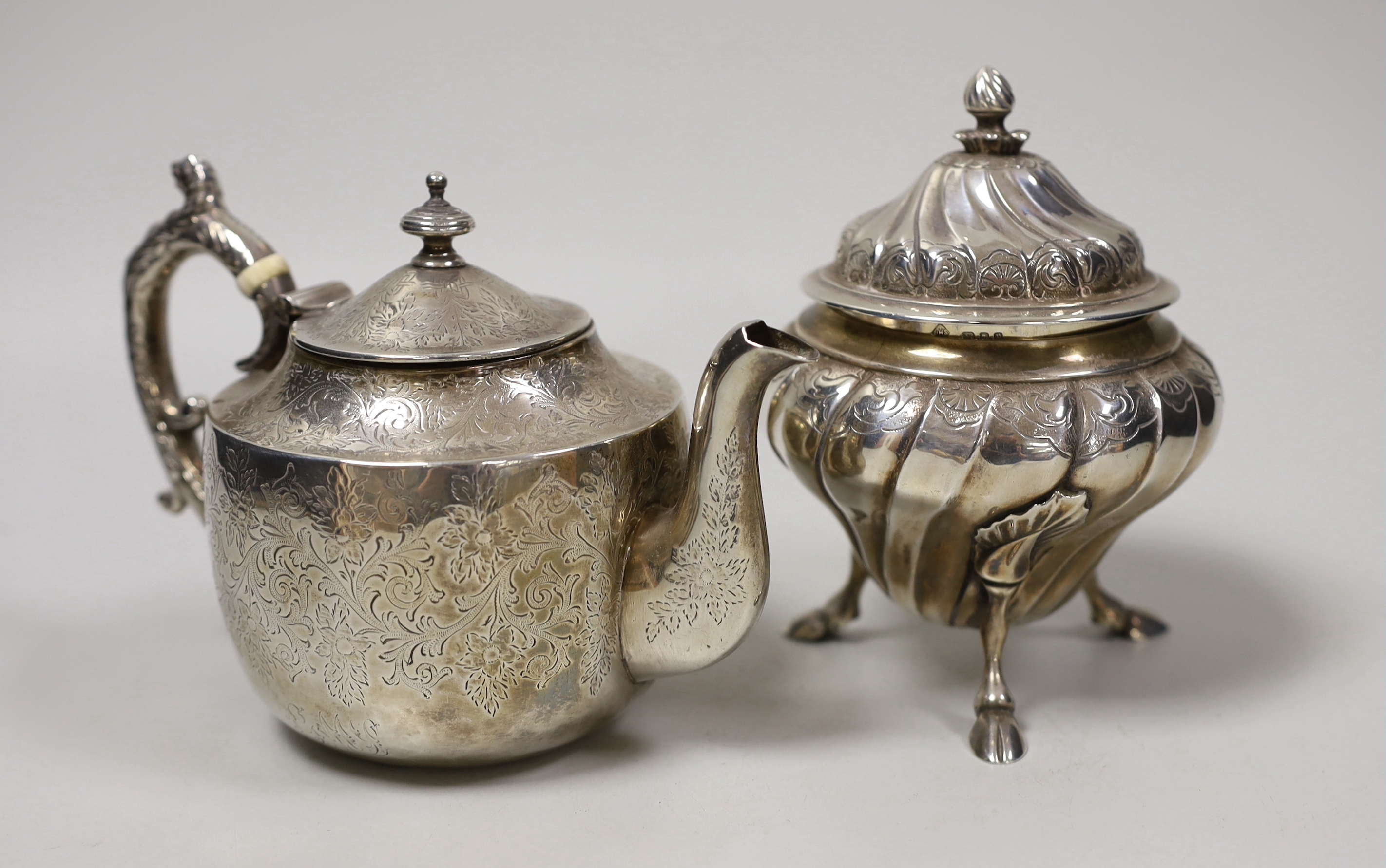 A small Victorian Scottish silver bachelor's teapot with ivory insulators, Glasgow, 1888 together with a small 1930's lidded silver tea caddy, gross weight 19oz.